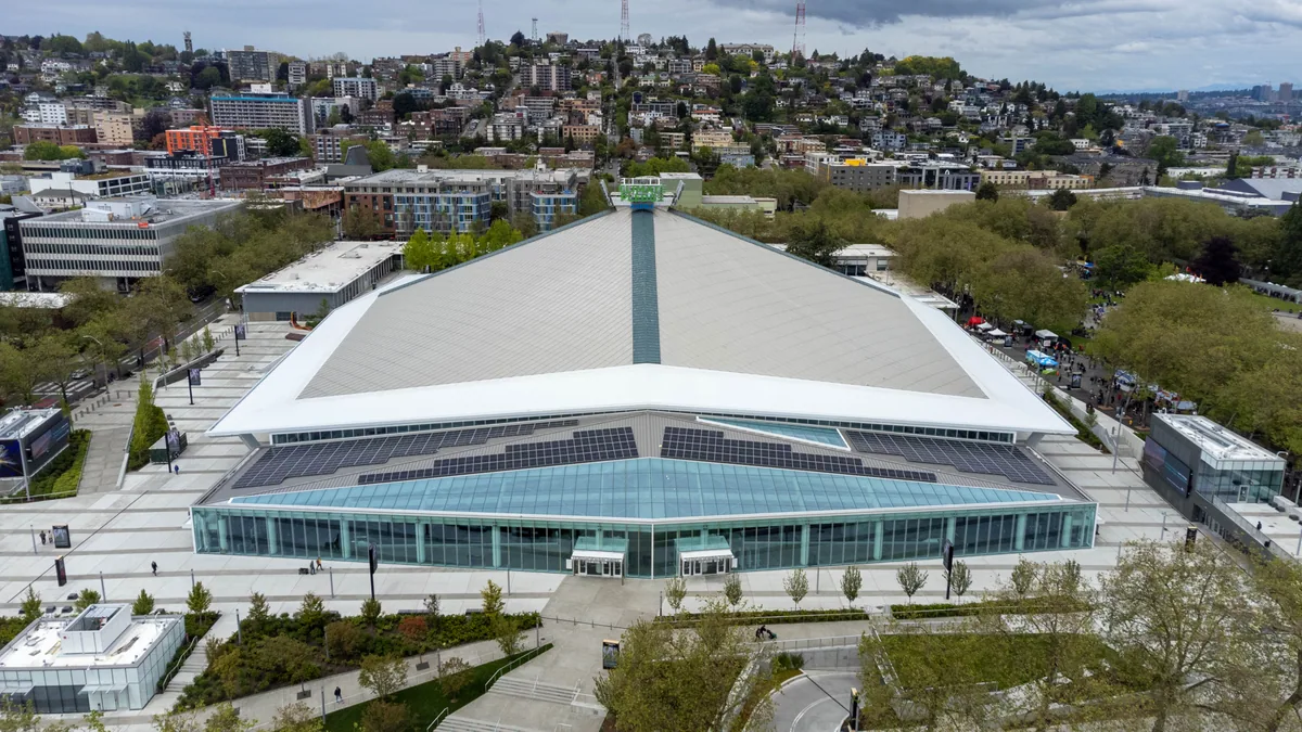 Climate Pledge Arena and its surrounding streets and greenery at Seattle Center